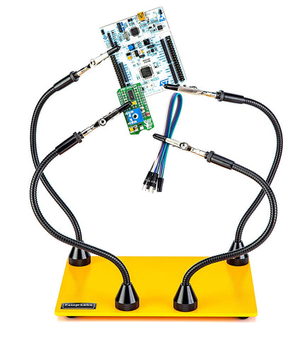 a yellow stand with black wires and a circuit board with text: 'F411RE Fstop Labs'
