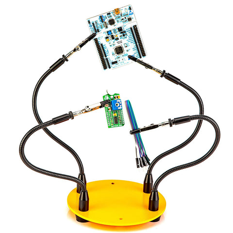 a yellow stand with wires and circuit boards