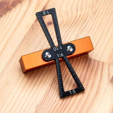 a black and orange tool on a wood surface with text: '1:8 1:6 1:10 1:5'