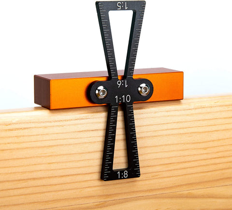 a black and orange square on a wood surface with text: '1:5 1:10 1:6 1:8'