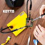 a person holding a soldering device with text: 'KOTTO'