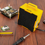 a yellow square box with a black cord next to a soldering iron with text: 'KOTTO'